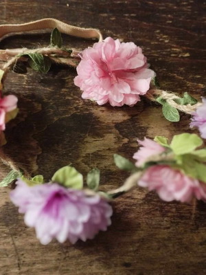 Hairband wreath used with 5 pink purple flowers and green leaves