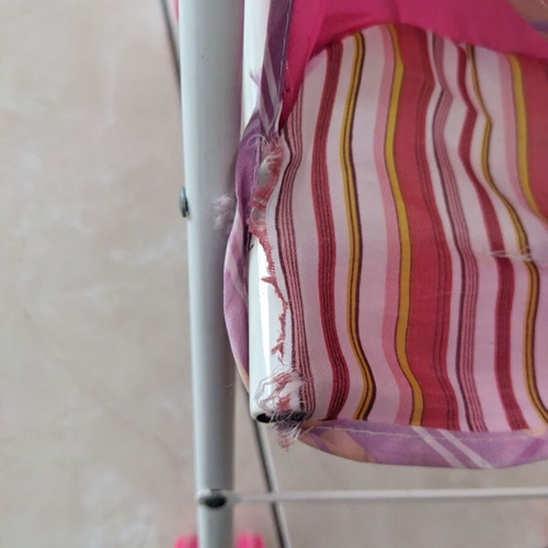 Doll stroller used with wear and fabric tears