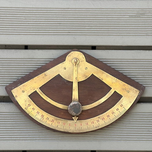 Vintage wooden wall protractor with brass details, used