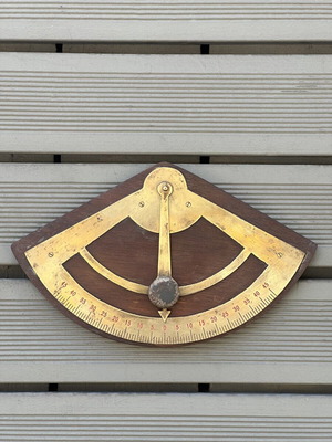 Vintage wooden wall protractor with brass details, used
