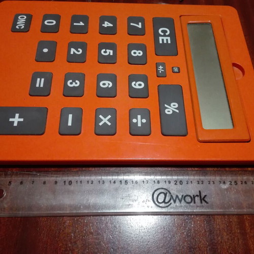 Giant calculator used, orange, A4 size