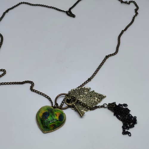 Vintage necklace with antique bronze elements and peacock feather heart pendant like new
