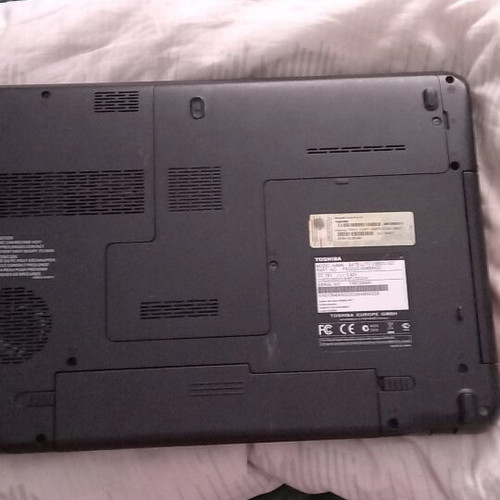 Toshiba Satellite C660D-10D laptop used with charger and accessories