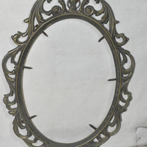 Brass oval frame used with embossed vintage design