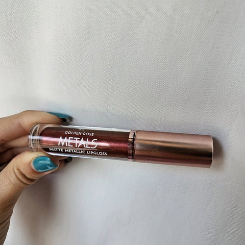 Liquid matte metallic lipstick used, dark brown