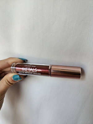 Liquid matte metallic lipstick used, dark brown