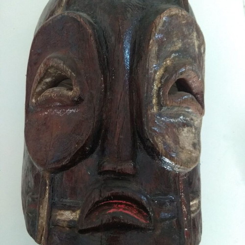 Handmade wooden mask used with aged patina