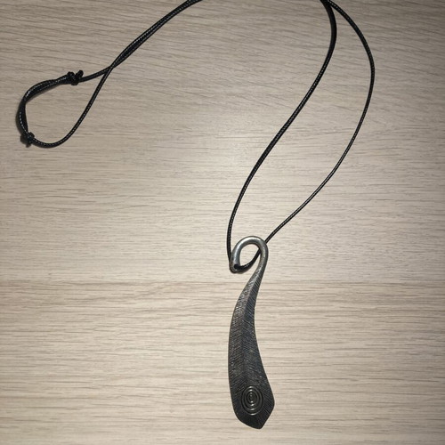 Statement metal pendant with embossed texture and adjustable cord, like new
