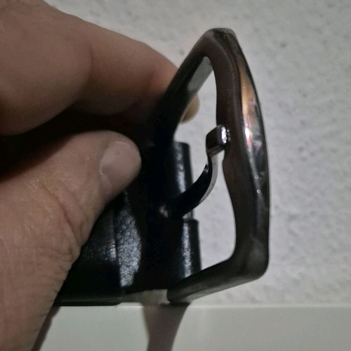 Simple metal belt buckle with prong and leather loop like new