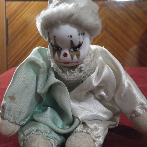 Porcelain clown doll used with white and green satin costume