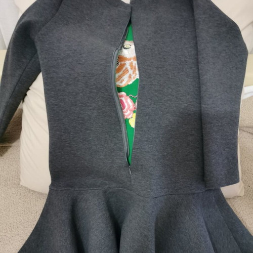 Elegant women's dress with peplum hem and embroidery