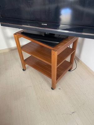 Rolling TV stand used, 60 cm width x 40 cm depth, three shelves