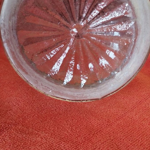 Glass wine carafe used with meander design