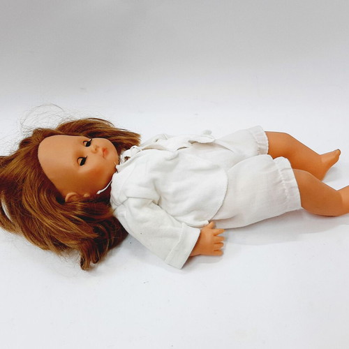 Vintage hard plastic doll with blue sleeping eyes, 1970s