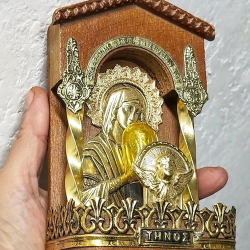 Vintage illuminated icon of Virgin Mary and Christ Child with lamp