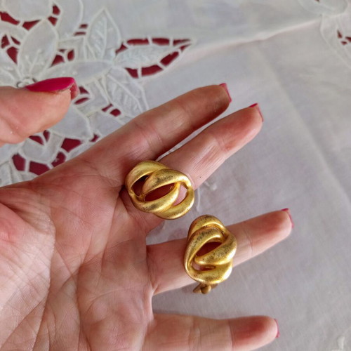 Clip-on earrings used, relief design, bronze tone