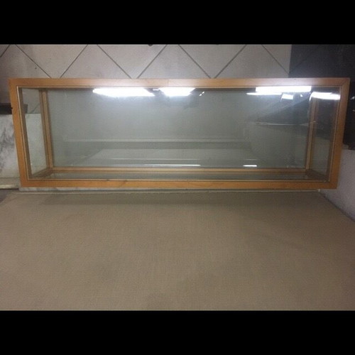 Console used with wooden frame and glass surfaces