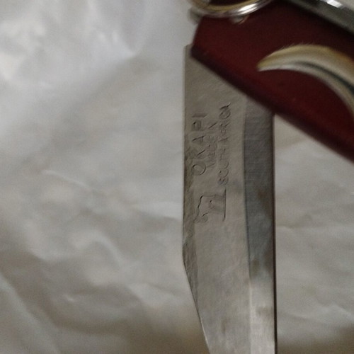 Okapi folding knife with rosary gift, like new