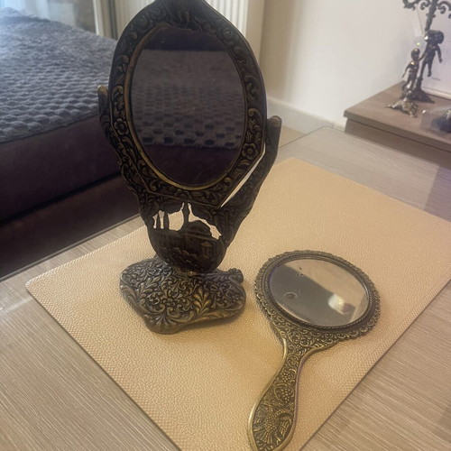 Set of two brass mirrors, table and hand used