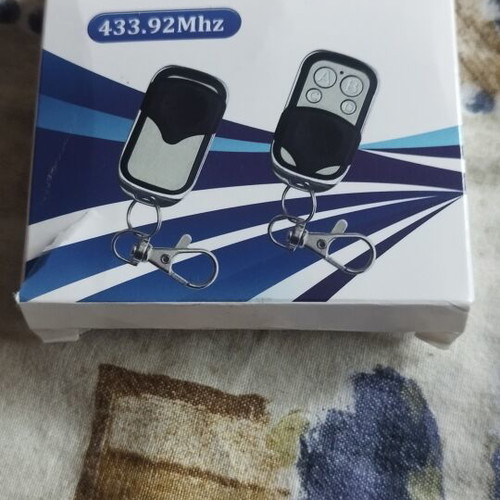Garage door remote new, single piece
