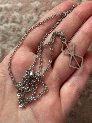 Berserk pendant like new from the eponymous anime
