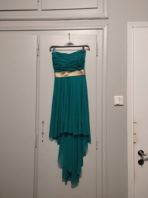 formal light blue dress with gold detail at the waist