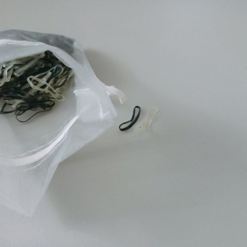 Disposable hair elastics black and transparent like new