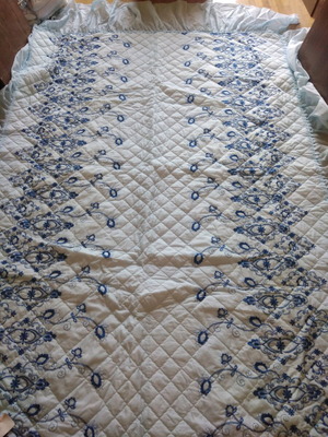 Quilted bedspread new, sky blue with flounces