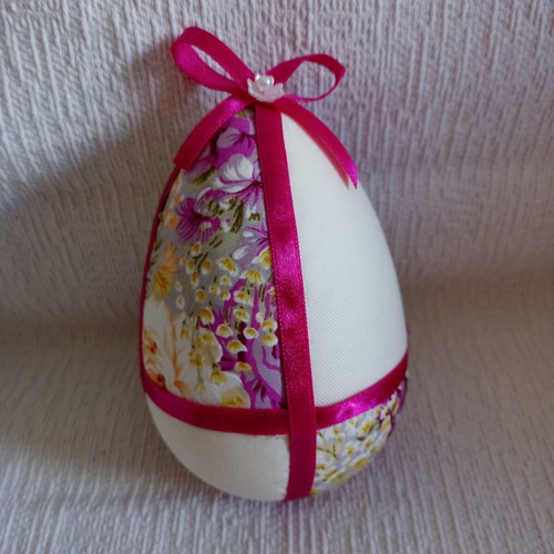 Decorative egg used in floral purple and fuchsia