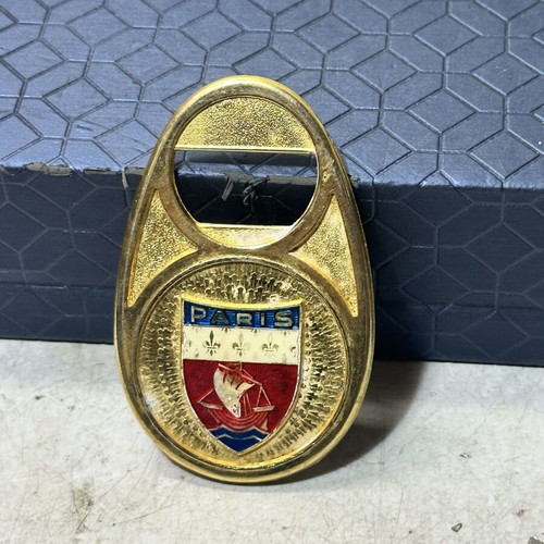 Vintage metal bottle opener Paris with embossed city crest, used
