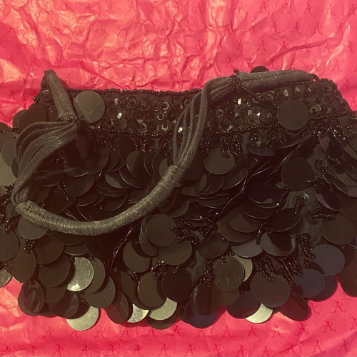 Accessorize bag like new with black sequins handheld