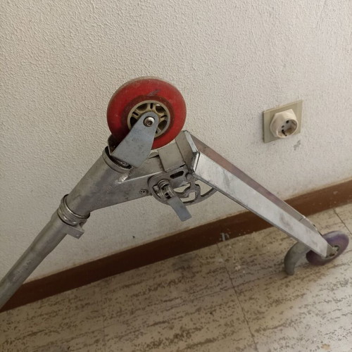 Silver metal scooter used, lightweight and foldable