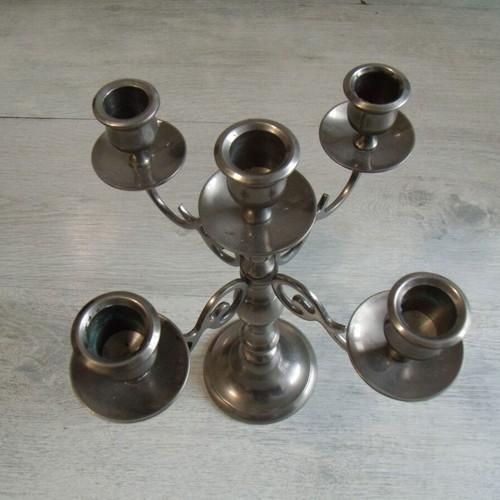 Old metal candlestick with five holders used