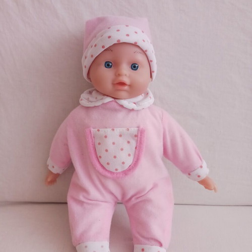 Baby doll with pink clothes like new