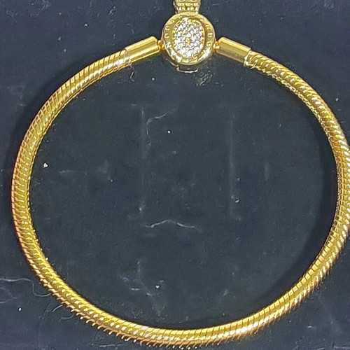 Pandora bracelet size 20 cm, gold plated with crown clasp