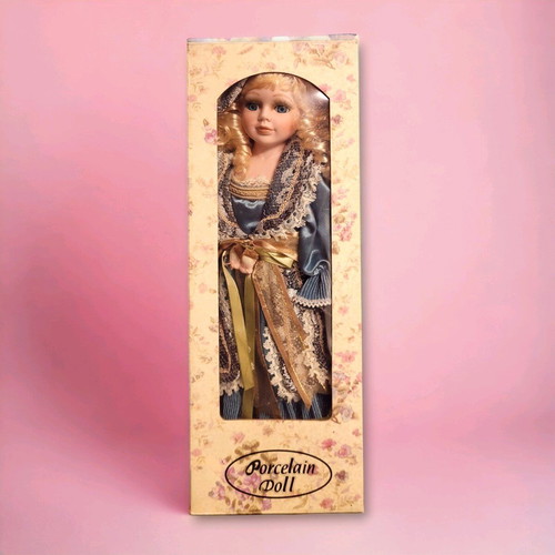 Vintage porcelain doll from the 90s like new
