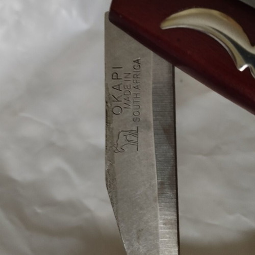 Okapi folding knife with rosary gift, like new