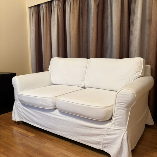 Two-seater sofa with white fabric cover like new