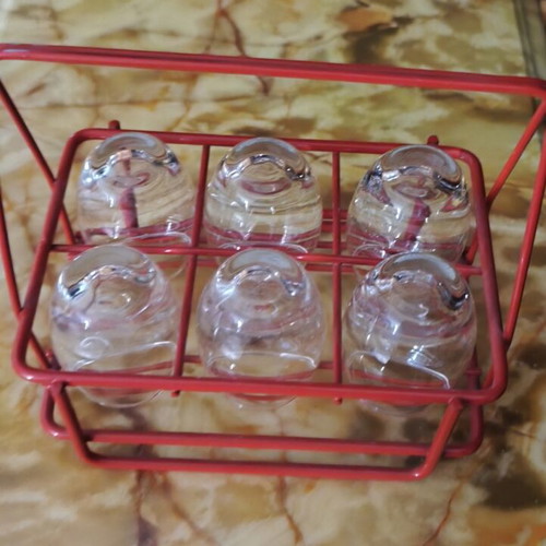 Vintage liqueur set with 6 glasses and red metal holder like new