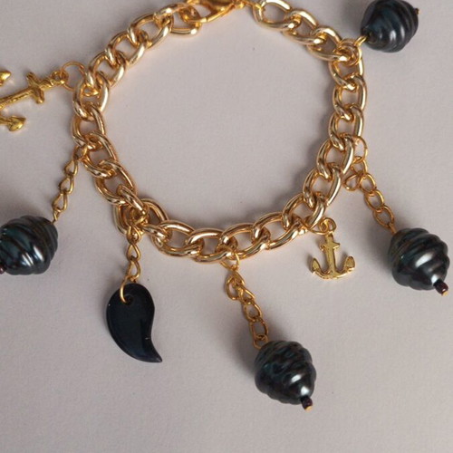 Gold bracelet with charms, new, dark blue details