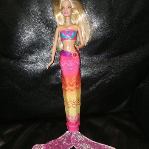 Barbie Merliah doll used with surfboard and mermaid tail