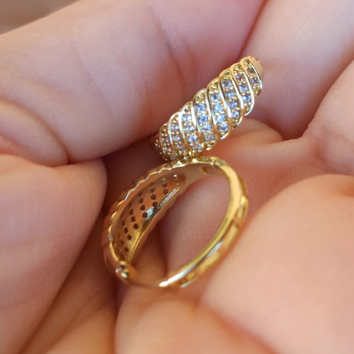 Gold-colored hoop earrings with white zircon stones, copper