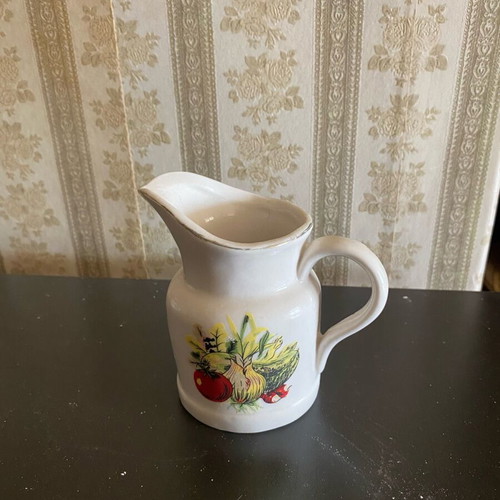 Small used jug with designs