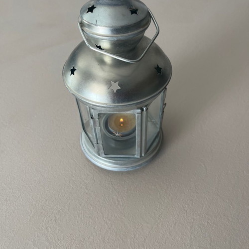 Silver candle lantern used for garden, balcony, or indoor candle