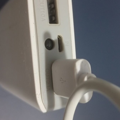 USB charger with flashlight, used, two charging ports