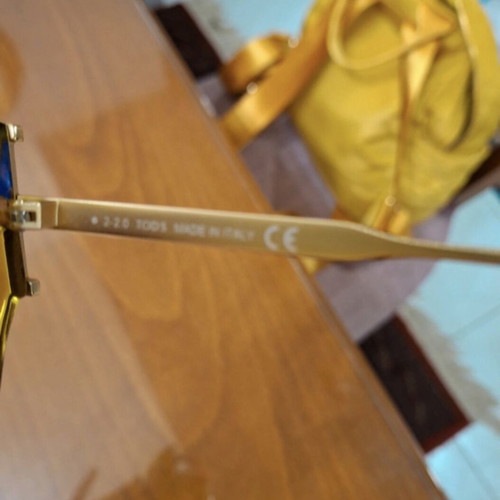Tod's sunglasses new, gold color