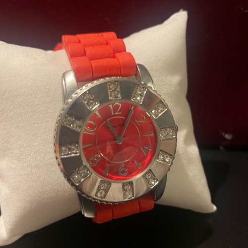 Women's wristwatch like new with red silicone strap and silver case
