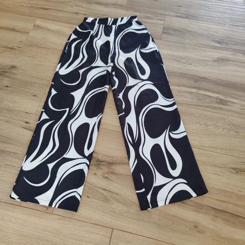 High-waisted wide-leg pants with abstract black and white print like new