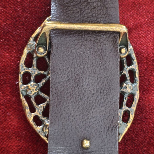 Wide gold belt used with decorative buckle and rhinestones