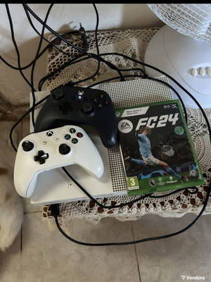 Xbox One S console with two controllers and FC24 game